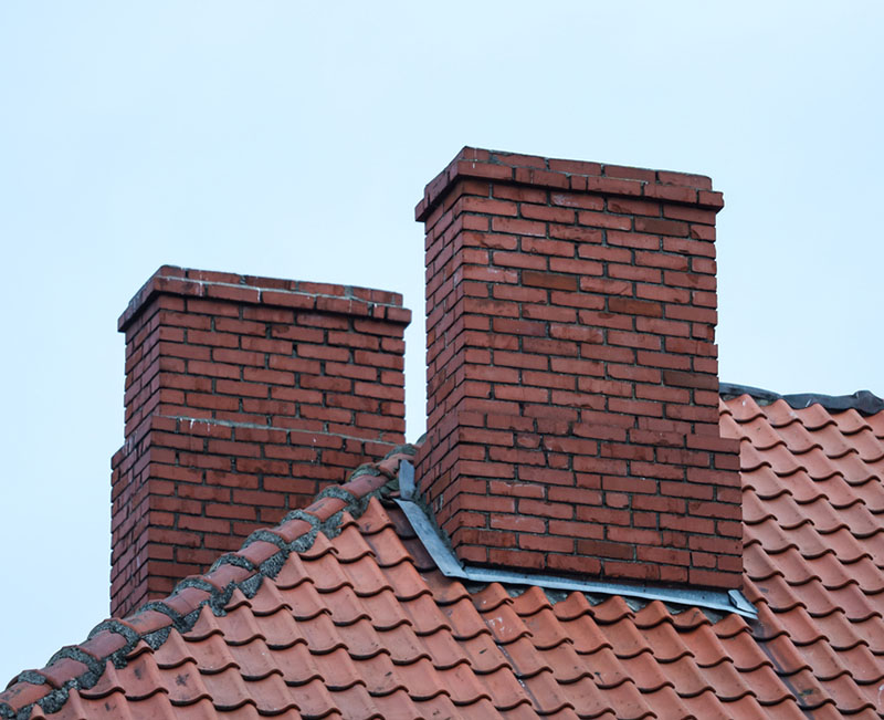 Two red brick chimneys